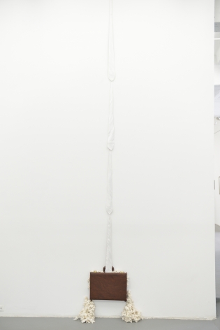 LEVESTER WILLIAMS The White Ladder 2013, hand-picked cotton from a southern plantation, leather briefcase, cotton ties, thread, 108 x 20 x 9 inches. Installation view: CONNERSMITH.